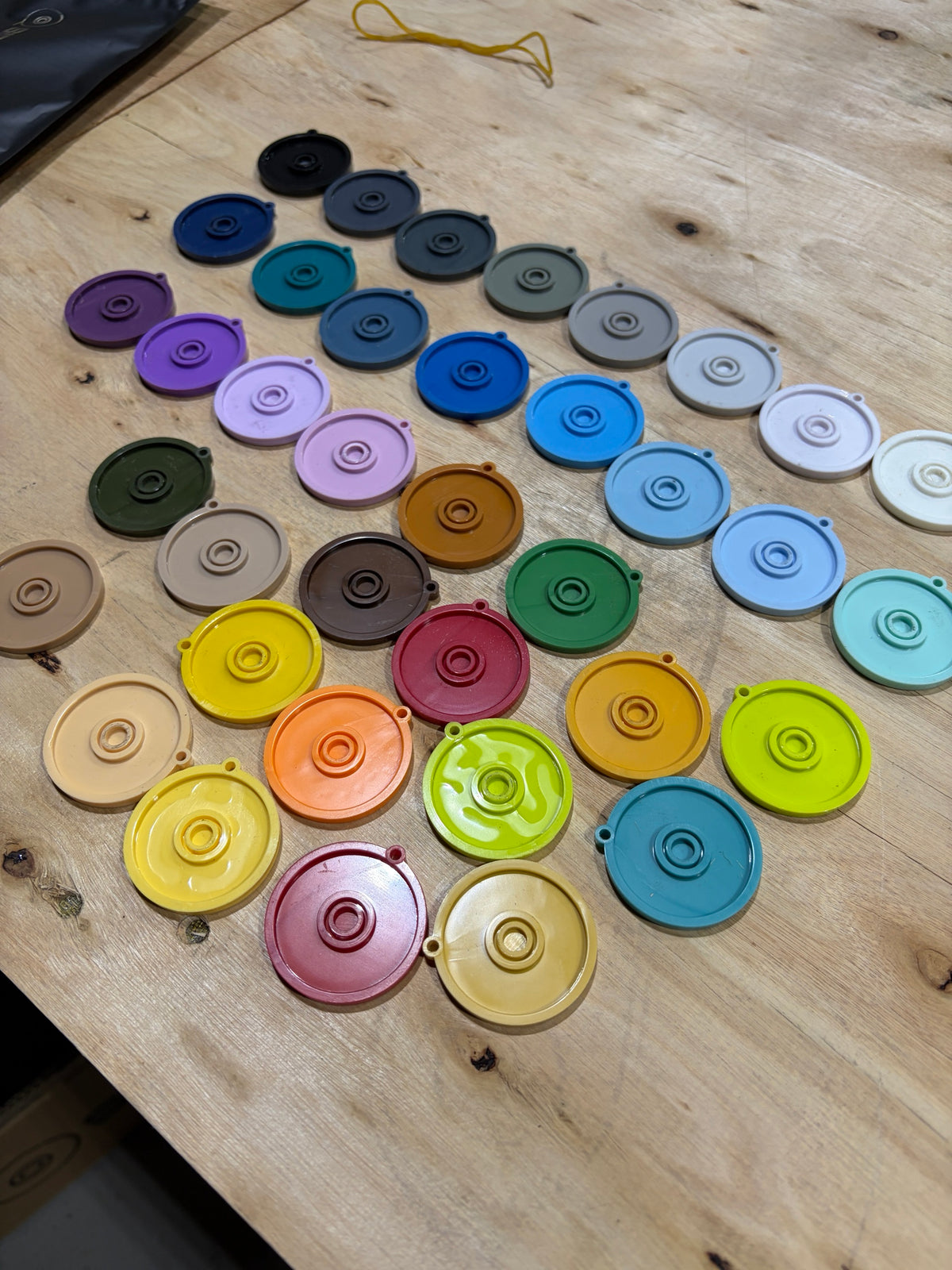 PLA+ V2 swatch discs on the bench