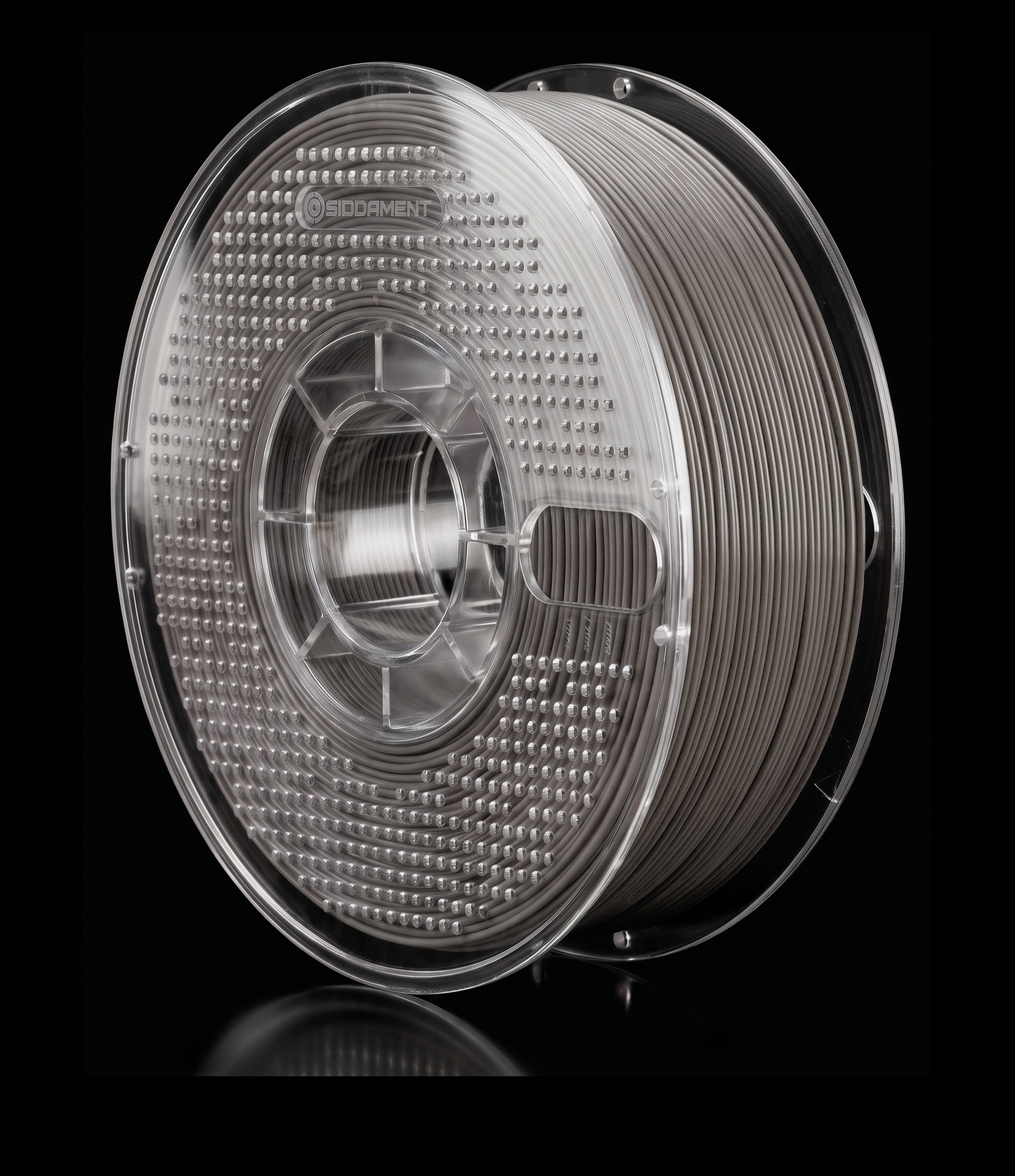 Matte Cement PLA V2 matte PLA filament on a clear SIDDAMENT spool