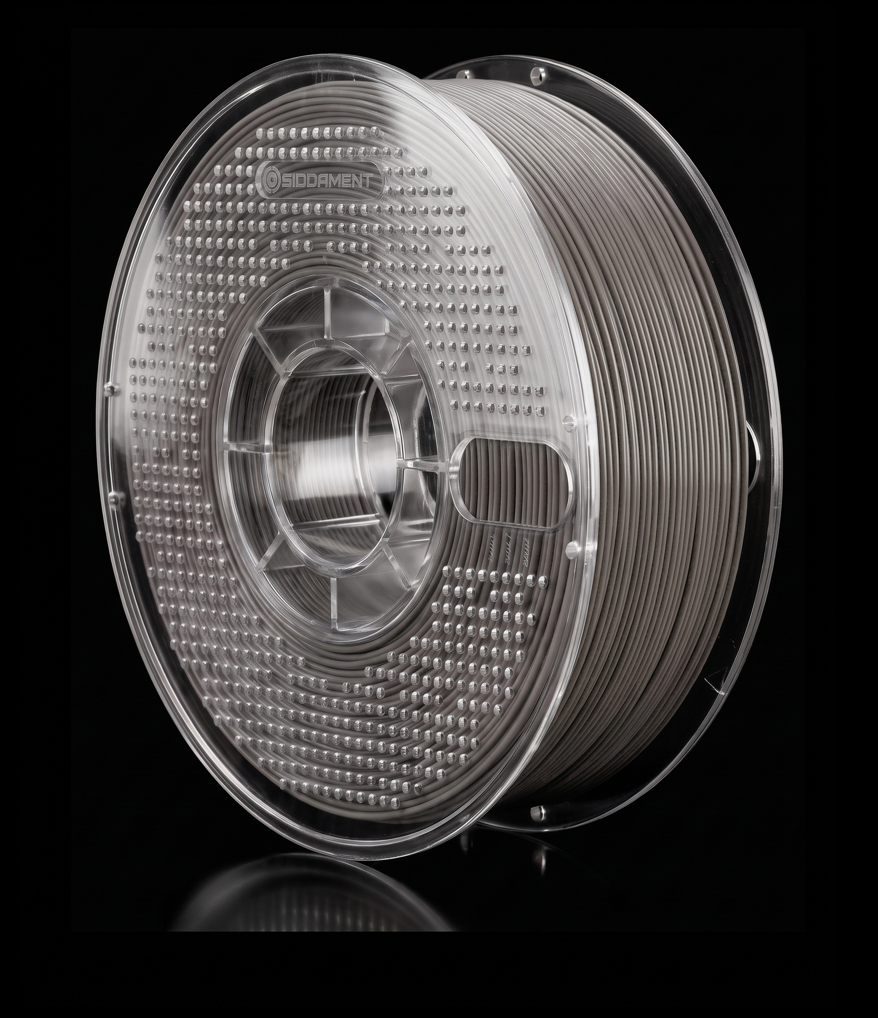 Matte Cement PLA V2 matte PLA filament on a clear SIDDAMENT spool